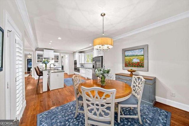 66 Mobile Ave NE, Atlanta, GA 30305 - dining area featuring ornamental molding, wood finished floors, baseboards, recessed lighting, and a chandelier