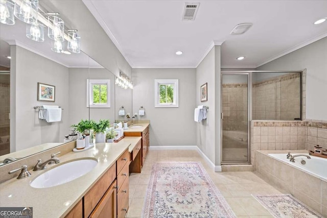 66 Mobile Ave NE, Atlanta, GA 30305 - bathroom with double vanity, a shower stall, a garden tub, tile patterned floors, and crown molding