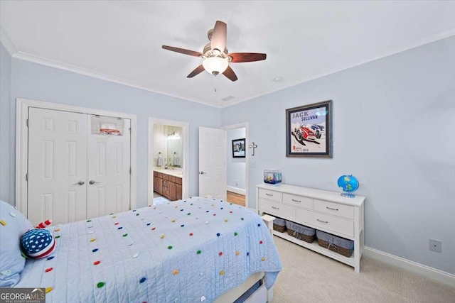 66 Mobile Ave NE, Atlanta, GA 30305 - carpeted bedroom with crown molding, a closet, baseboards, ceiling fan, and ensuite bathroom