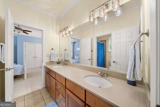 66 Mobile Ave NE, Atlanta, GA 30305 - bathroom with double vanity, tile patterned floors, connected bathroom, a ceiling fan, and toilet