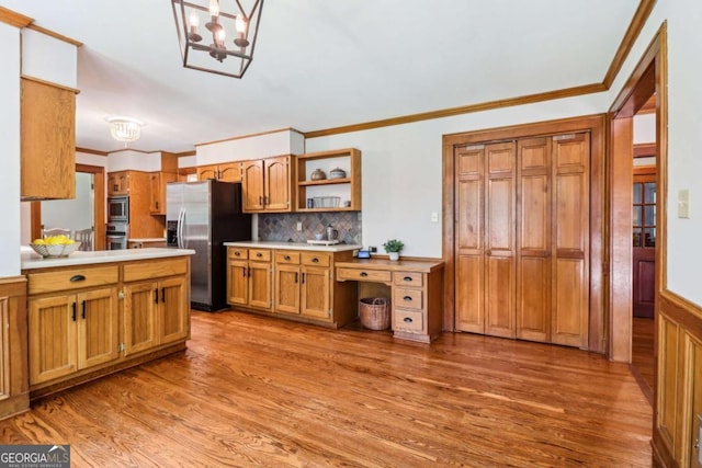 kitchen with stainless steel appliances, light wood-type flooring, brown cabinets, open shelves, and light countertops