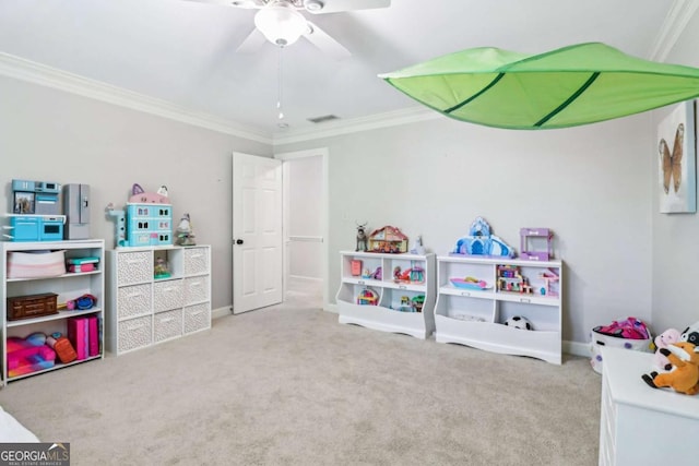 game room featuring crown molding, carpet floors, ceiling fan, and baseboards