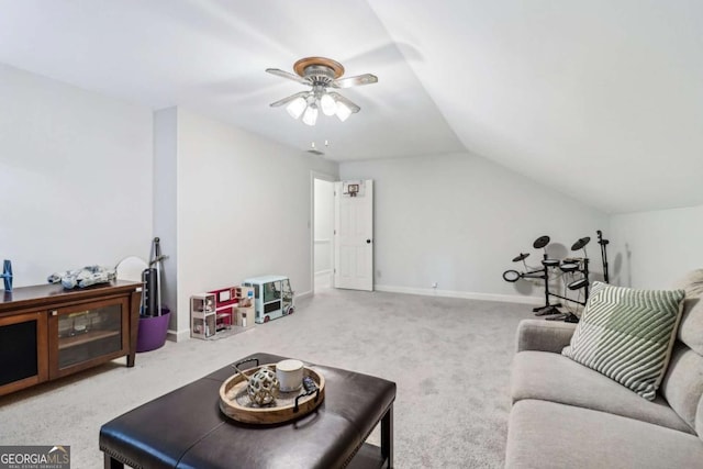 carpeted living room featuring lofted ceiling, ceiling fan, and baseboards