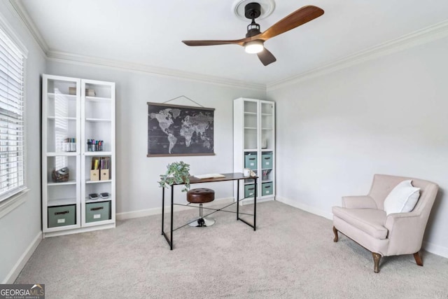 home office featuring carpet floors, a ceiling fan, crown molding, and plenty of natural light