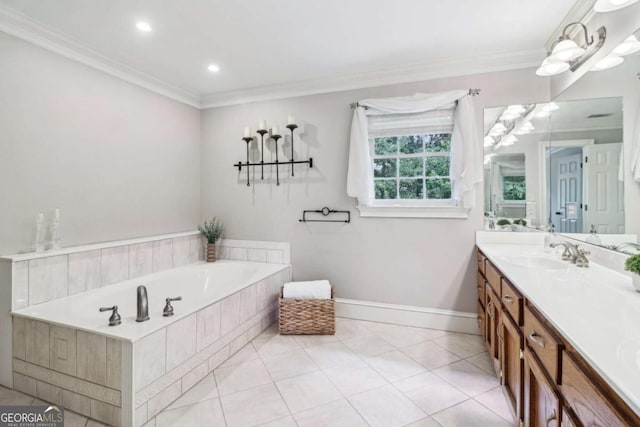 full bathroom with vanity, ornamental molding, a bath, baseboards, and tile patterned flooring