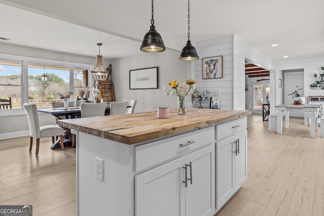 4739 Lower Jersey Rd, Oxford, GA 30054 - kitchen featuring wooden counters, light wood-type flooring, white cabinetry, decorative light fixtures, and recessed lighting