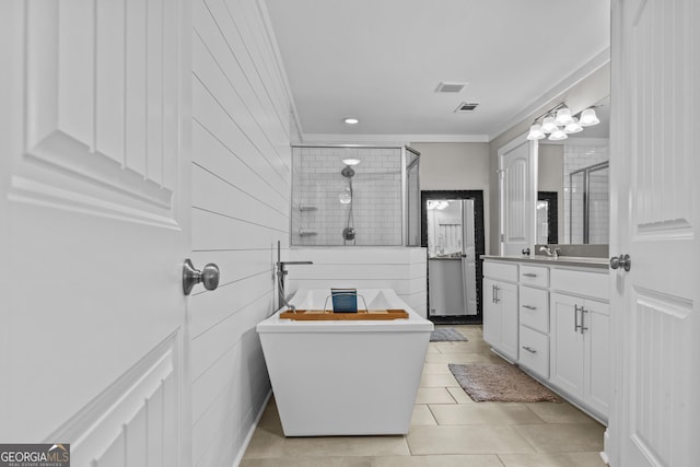 4739 Lower Jersey Rd, Oxford, GA 30054 - bathroom with ornamental molding, a stall shower, a freestanding bath, tile patterned flooring, and vanity