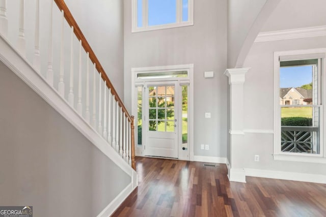 79 Gold Creek Ct, Dawsonville, GA 30534 - entrance foyer with decorative columns, healthy amount of natural light, baseboards, wood finished floors, and a towering ceiling