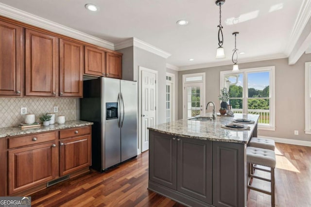79 Gold Creek Ct, Dawsonville, GA 30534 - kitchen featuring stainless steel fridge, a sink, dark wood-style floors, brown cabinets, and crown molding