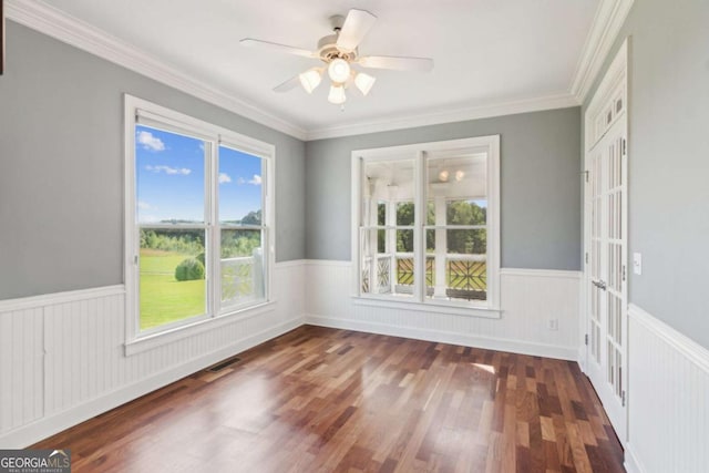 79 Gold Creek Ct, Dawsonville, GA 30534 - empty room with wainscoting, wood finished floors, ceiling fan, and crown molding