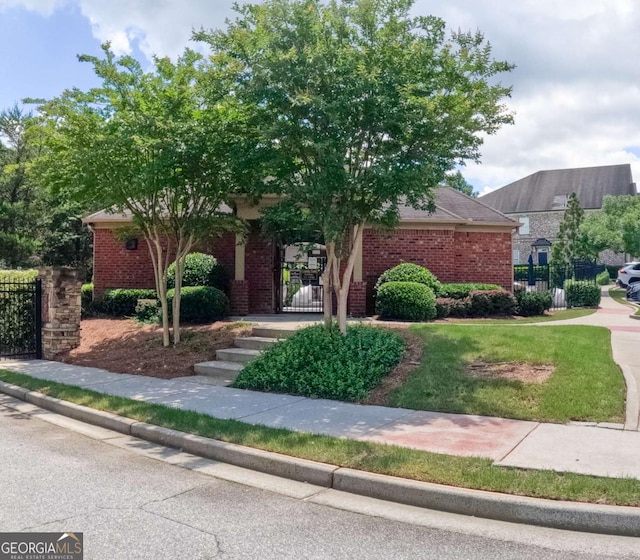 805 Pleasant Hill Rd NW Unit 343, Lilburn, GA 30047 - view of property hidden behind natural elements featuring brick siding