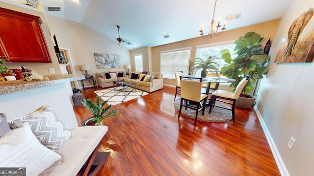 805 Pleasant Hill Rd NW Unit 343, Lilburn, GA 30047 - living room with wood finished floors, a chandelier, baseboards, and lofted ceiling