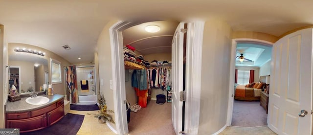 805 Pleasant Hill Rd NW Unit 343, Lilburn, GA 30047 - ensuite bathroom with a stall shower, ceiling fan, vanity, and a spacious closet