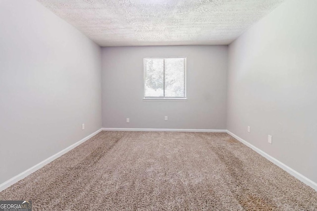 5509 Covent Way, Lithonia, GA 30058 - unfurnished room with a textured ceiling and carpet flooring