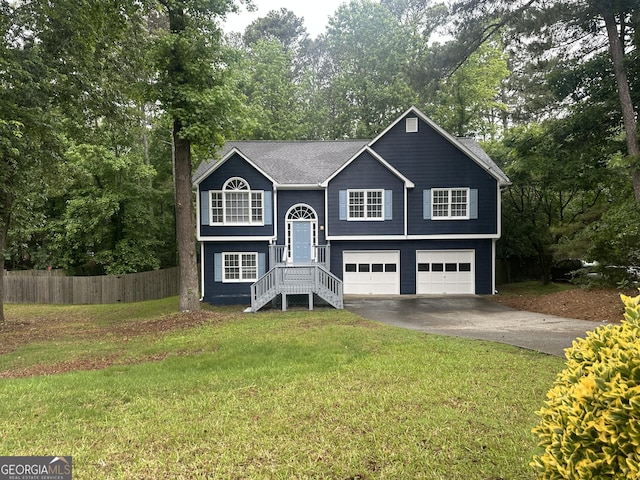 4790 Brandon Acres Ln, Buford, GA 30519 - bi-level home featuring concrete driveway, a garage, and view of wooded area