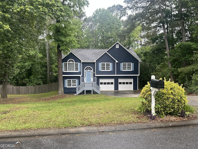 4790 Brandon Acres Ln, Buford, GA 30519 - raised ranch with asphalt driveway, a garage, and view of wooded area
