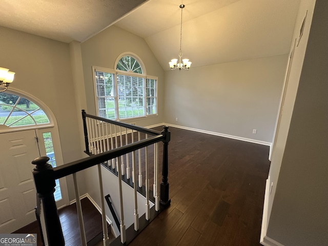 4790 Brandon Acres Ln, Buford, GA 30519 - entryway with a chandelier, dark wood finished floors, baseboards, and vaulted ceiling