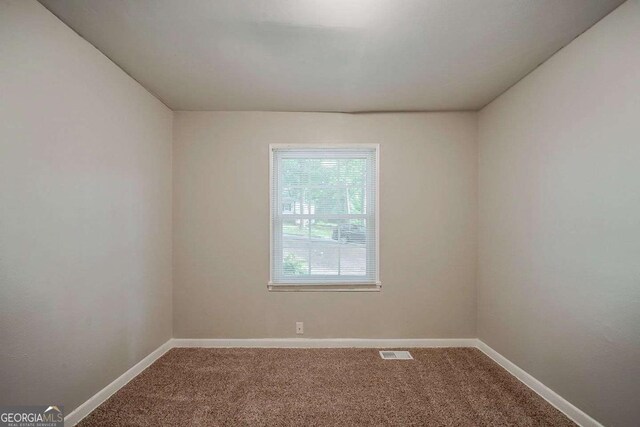 3731 Adkins Rd NW, Atlanta, GA 30331 - carpeted empty room with plenty of natural light and baseboards