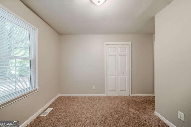 3731 Adkins Rd NW, Atlanta, GA 30331 - carpeted spare room with baseboards