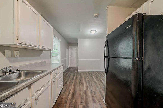 3731 Adkins Rd NW, Atlanta, GA 30331 - kitchen featuring freestanding refrigerator, white cabinets, wood finished floors, and light countertops