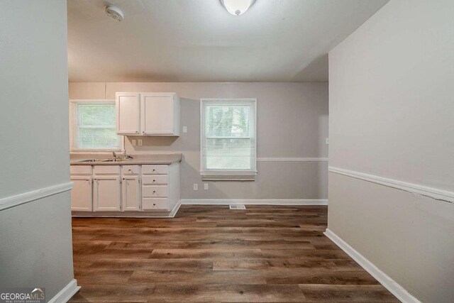 3731 Adkins Rd NW, Atlanta, GA 30331 - spare room with dark wood-type flooring, plenty of natural light, and baseboards