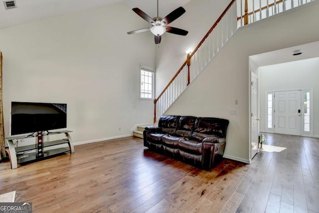 1095 S Bethany Creek Dr, Alpharetta, GA 30004 - living area featuring high vaulted ceiling, stairway, ceiling fan, wood-type flooring, and baseboards