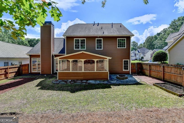 1095 S Bethany Creek Dr, Alpharetta, GA 30004 - rear view of property featuring a fire pit, a chimney, a patio area, and a sunroom