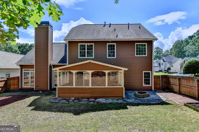 1095 S Bethany Creek Dr, Alpharetta, GA 30004 - back of house featuring a fire pit, a patio area, a chimney, a sunroom, and a shingled roof