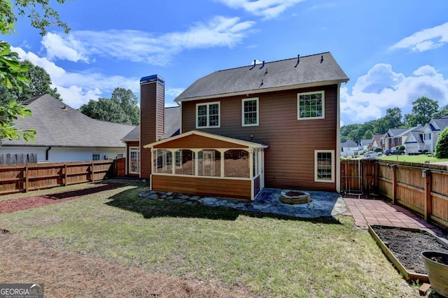 1095 S Bethany Creek Dr, Alpharetta, GA 30004 - back of house with a sunroom, a patio area, a chimney, and an outdoor fire pit