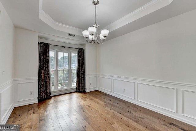 1095 S Bethany Creek Dr, Alpharetta, GA 30004 - spare room featuring a chandelier, crown molding, a decorative wall, hardwood / wood-style floors, and a wainscoted wall