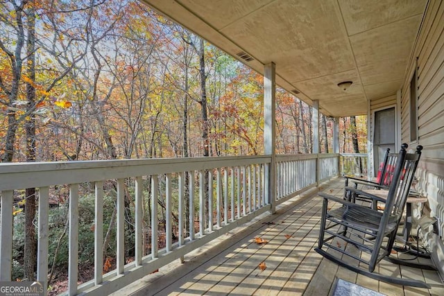 wooden terrace featuring a porch