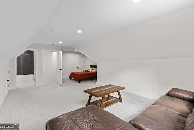bedroom featuring light carpet, lofted ceiling, baseboards, and recessed lighting