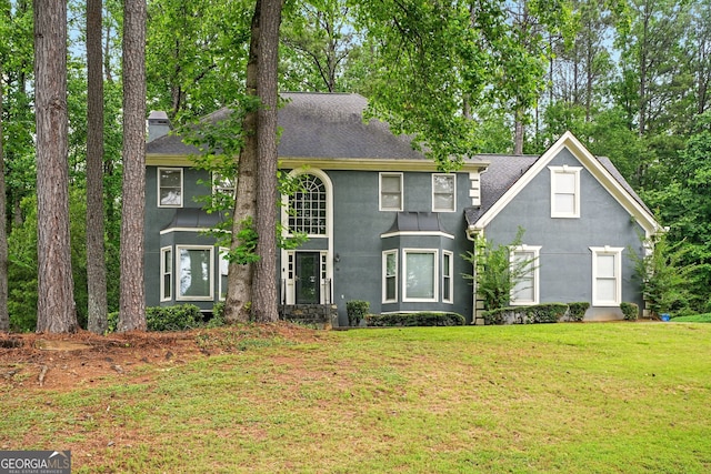 1256 Spring Park Dr SW, Atlanta, GA 30311 - view of front facade with roof with shingles, stucco siding, and a front yard