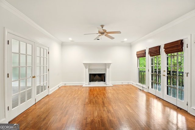 1256 Spring Park Dr SW, Atlanta, GA 30311 - unfurnished living room featuring french doors, a ceiling fan, light wood-type flooring, ornamental molding, and a fireplace