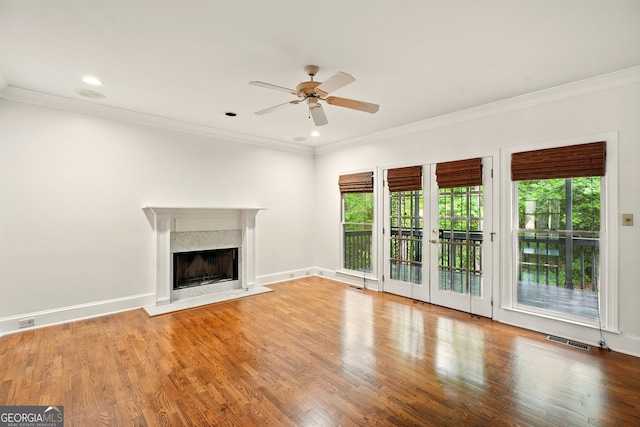 1256 Spring Park Dr SW, Atlanta, GA 30311 - unfurnished living room with a ceiling fan, crown molding, wood finished floors, a premium fireplace, and baseboards