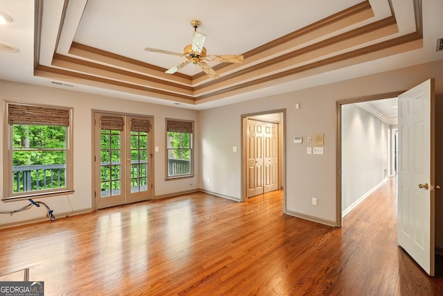 1256 Spring Park Dr SW, Atlanta, GA 30311 - empty room featuring a raised ceiling, a ceiling fan, light wood finished floors, crown molding, and baseboards