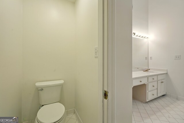 1256 Spring Park Dr SW, Atlanta, GA 30311 - bathroom with vanity, tile patterned floors, toilet, and baseboards