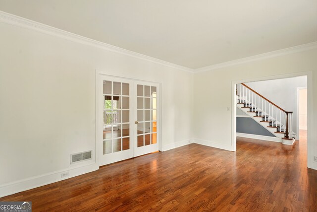 1256 Spring Park Dr SW, Atlanta, GA 30311 - empty room with stairway, crown molding, french doors, wood finished floors, and baseboards