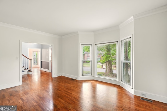1256 Spring Park Dr SW, Atlanta, GA 30311 - unfurnished room with plenty of natural light, stairway, wood finished floors, ornamental molding, and baseboards