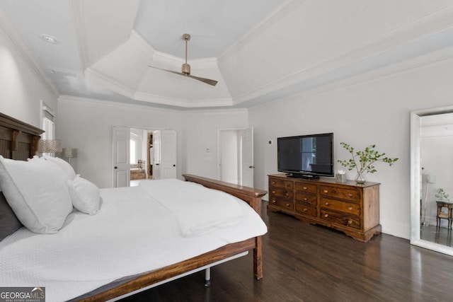 bedroom with wood finished floors, ornamental molding, and a ceiling fan