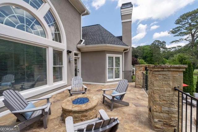 view of patio featuring a fire pit