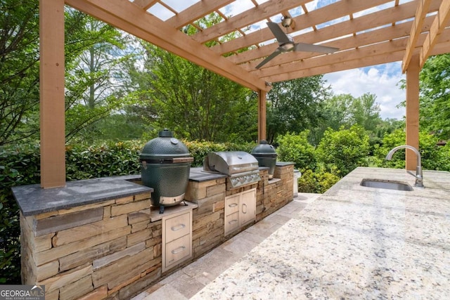 view of patio / terrace featuring a sink, area for grilling, an outdoor kitchen, and a pergola