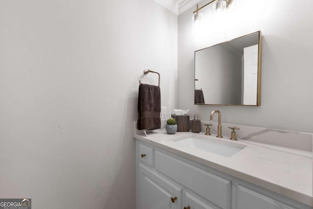 bathroom featuring vanity and crown molding