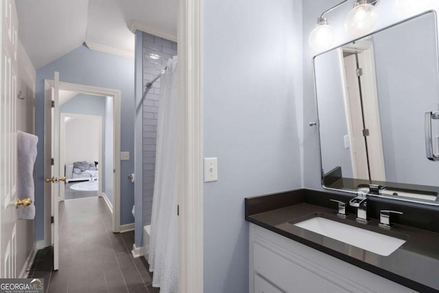 bathroom with vanity, baseboards, and a shower with shower curtain