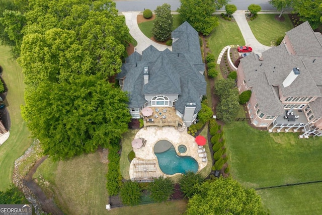 aerial view of property and surrounding area with a pool