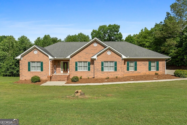 604 Clearwater Ct, Mcdonough, GA 30252 - view of front of house featuring brick siding, a front yard, and a shingled roof