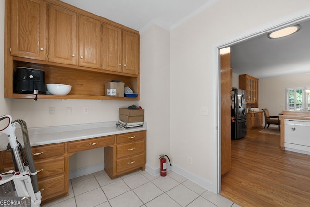 604 Clearwater Ct, Mcdonough, GA 30252 - office space with built in study area, crown molding, and light tile patterned flooring