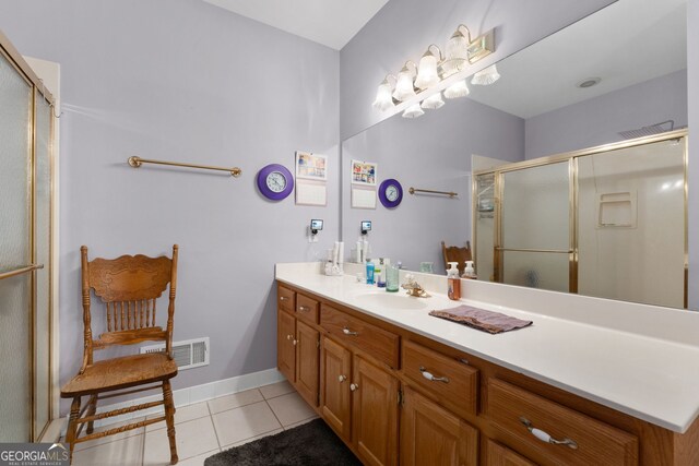 604 Clearwater Ct, Mcdonough, GA 30252 - bathroom with tile patterned flooring, vanity, and a stall shower