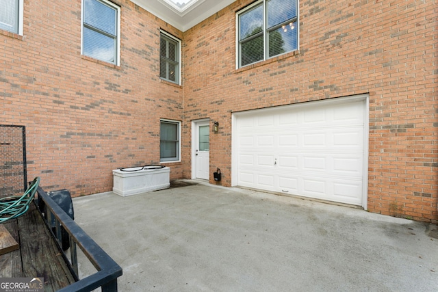 604 Clearwater Ct, Mcdonough, GA 30252 - back of property with a garage and brick siding