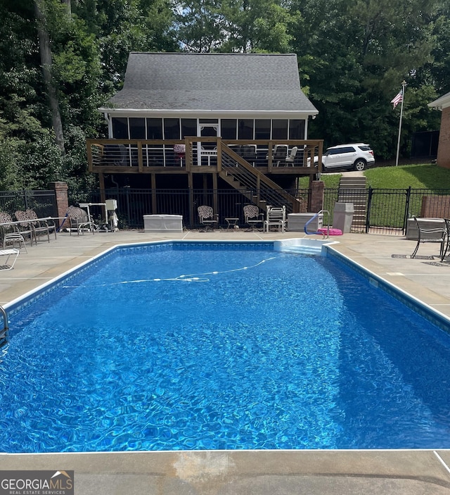 604 Clearwater Ct, Mcdonough, GA 30252 - view of swimming pool featuring stairs, a patio, and a wooden deck